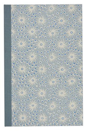 A blue book cover with white flowers on it.