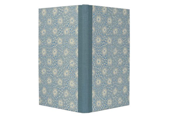 A book with a blue cover and white flowers.