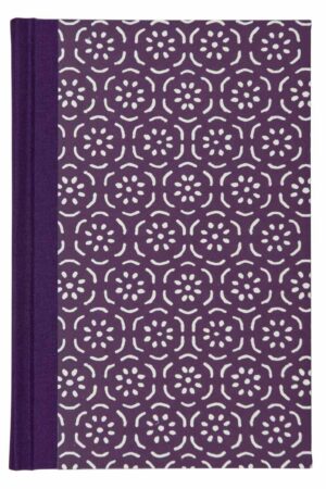 A purple book with white flowers on it.