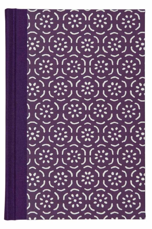 A purple book with white flowers on it.