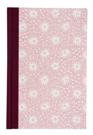 A pink and white floral pattern on the cover of a book.