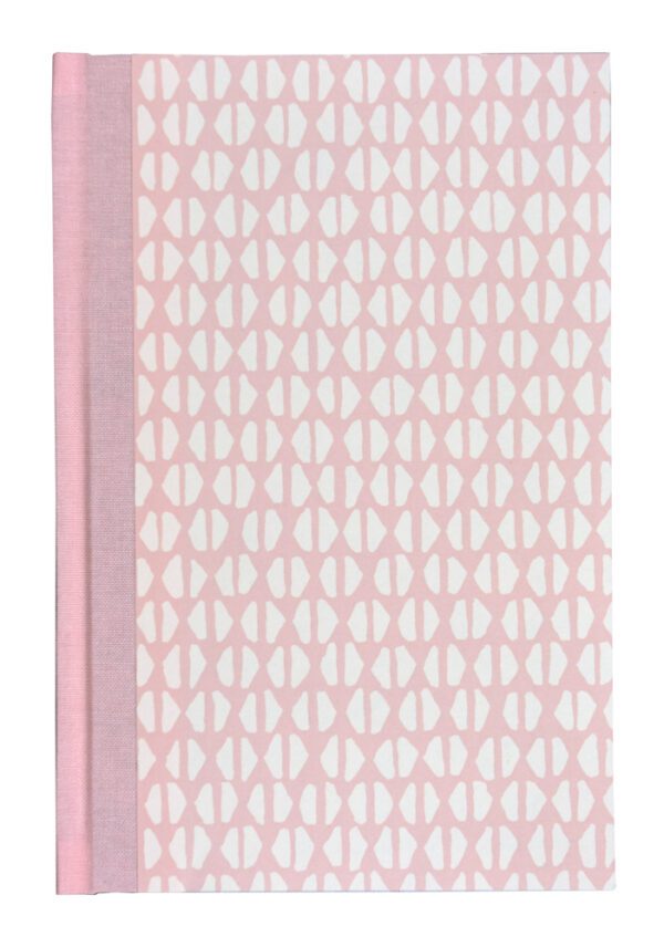 A pink and white pattern on the cover of a book.