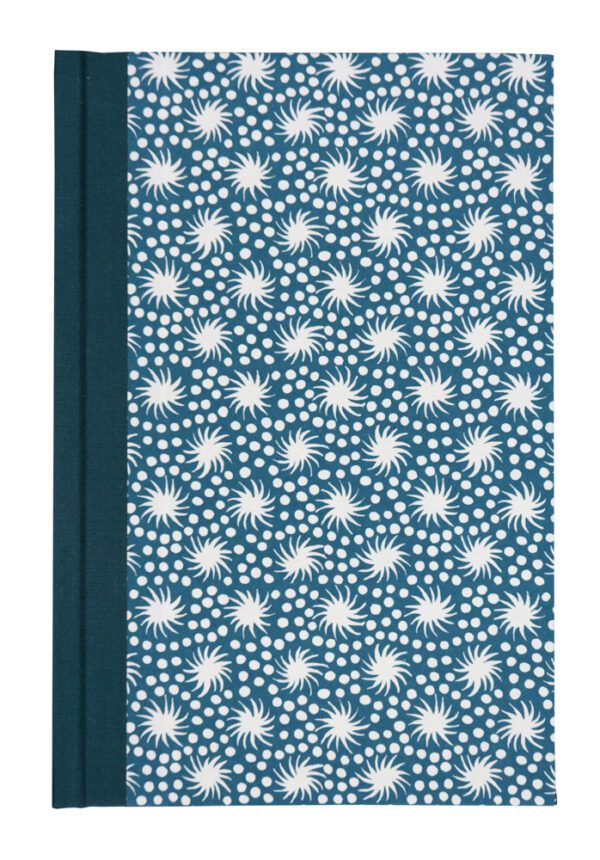 A blue book cover with white flowers on it.