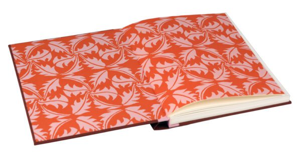 A book with an orange cover and white leaves.