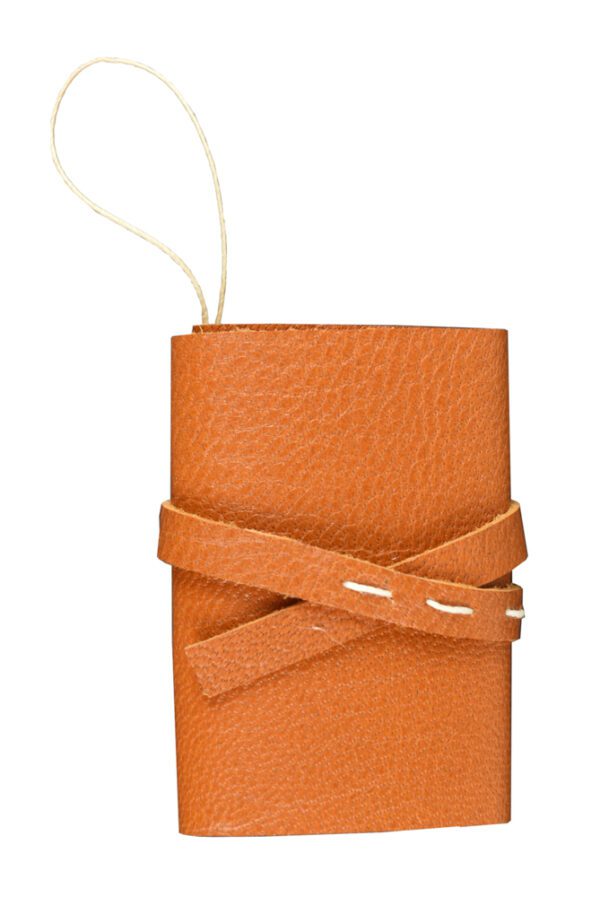 A brown leather case with a strap on the end.