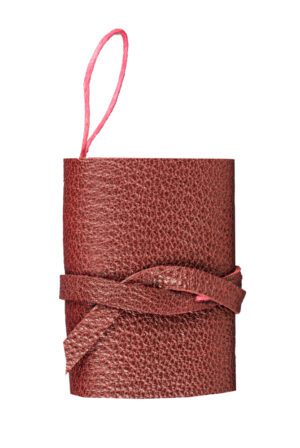 A red leather case with a pink string.