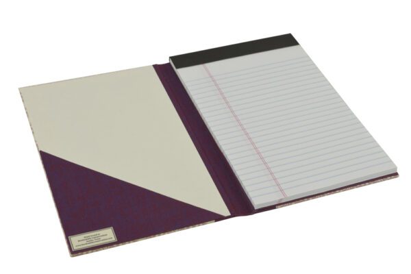 A purple and white notebook with a note pad.