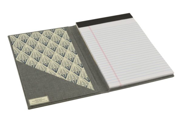 A notebook with a cover and a note pad.