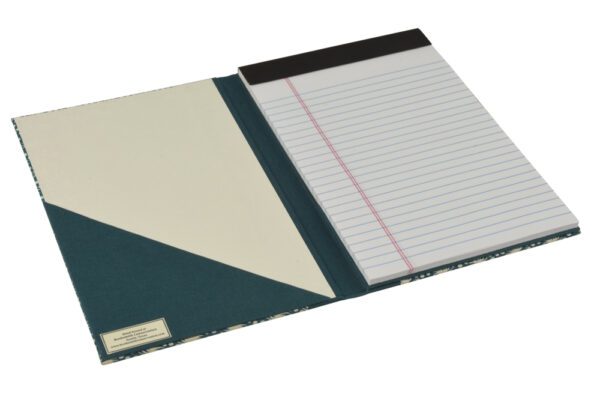 A notebook with a blue cover and lined paper.