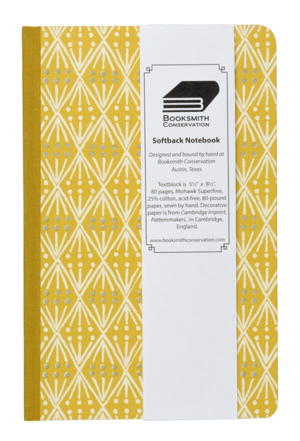 A yellow cover with white pattern on it.