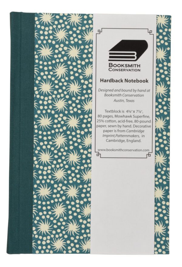 A notebook with a cover and some flowers on it