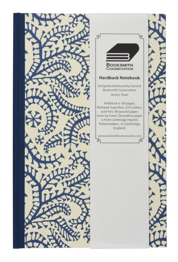 A blue and white notebook with a cover.