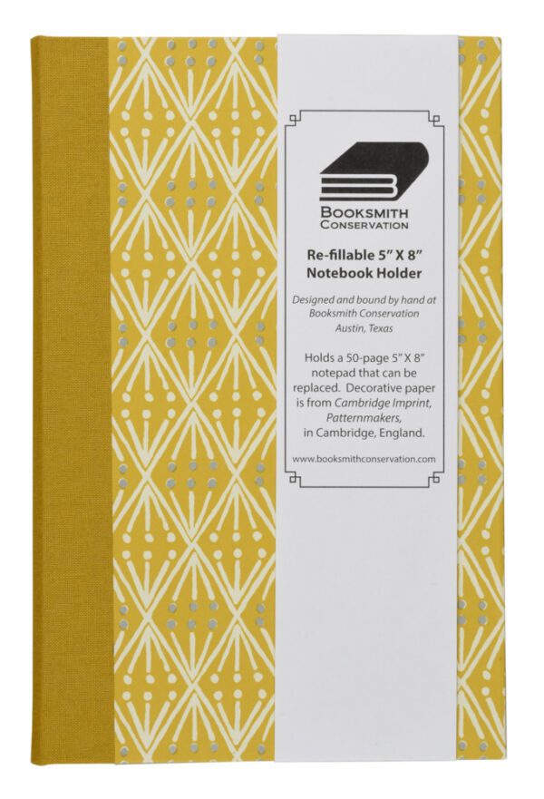 A yellow and white cover of the book