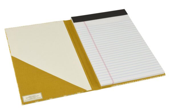 A notebook with a yellow cover and lined paper.