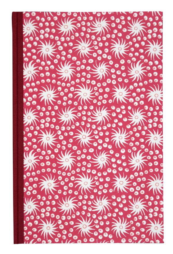 A red and white pattern is on the cover of a book.