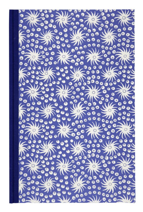 A blue book with white flowers on it.