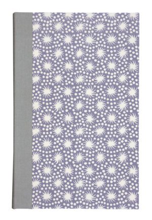 A notebook with a pattern of white flowers.