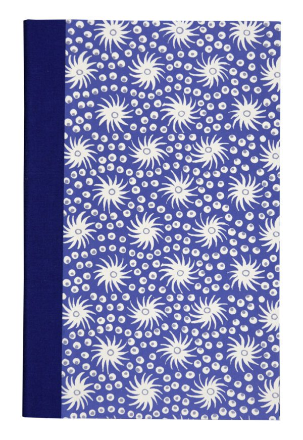 A blue book cover with white flowers on it.