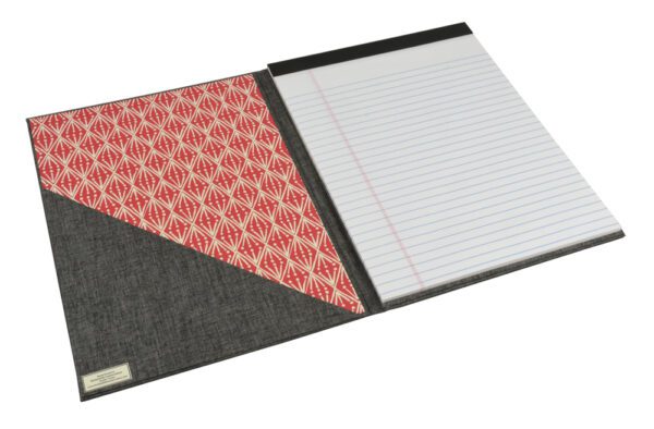 A black and red folder with papers on it