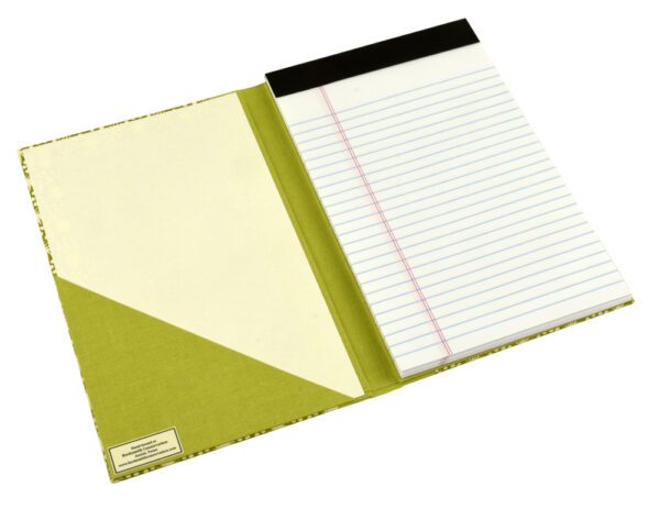 A notebook with a green cover and white paper.