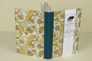 Floral-covered hardback notebook.