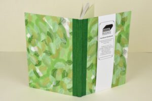 Green leaf-patterned hardback notebook.