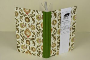 Floral patterned hardback notebook.