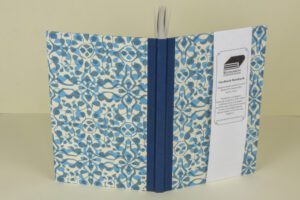 Blue patterned hardback notebook.