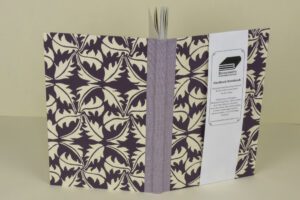Purple leaf patterned hardback notebook.