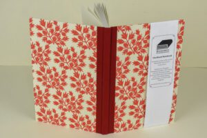 Red floral hardcover notebook.