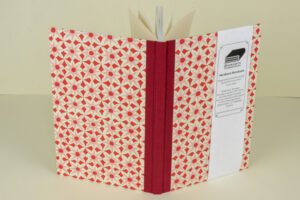 Red floral hardcover notebook.