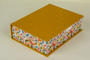 Mustard box with floral lining.