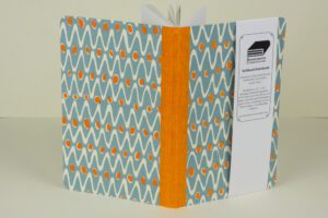 Orange and blue patterned notebook.