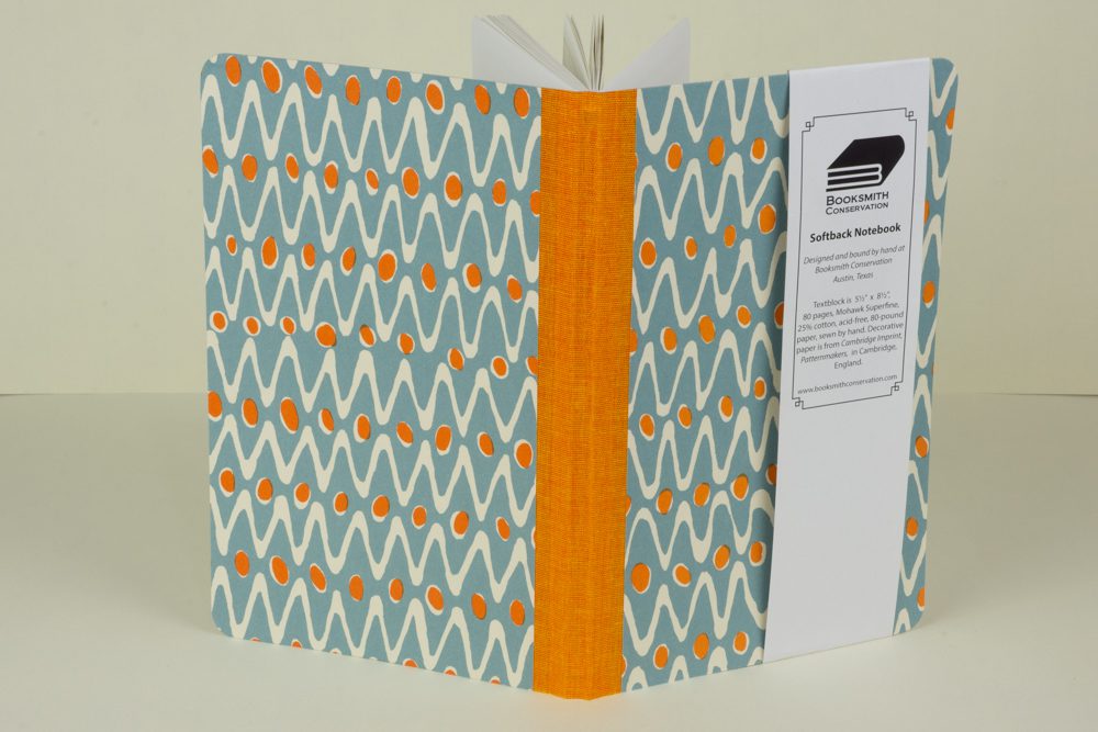 Orange and blue patterned notebook.