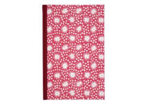 Red notebook with white floral pattern.