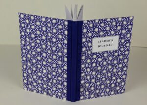 Reader's journal, blue cover, white stars.