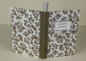 Reader's journal with ornate cover.