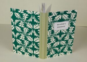 Reader's journal with green leaf pattern.