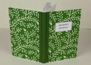 Green reader's journal with leaf pattern.