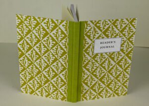 Reader's journal with green cover.