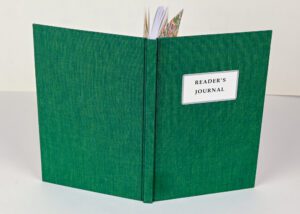 Green reader's journal, open and blank.
