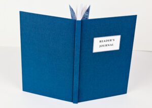 Blue reader's journal, open book.