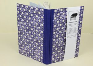 Handmade hardback notebook, blue floral cover.