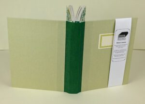 Handcrafted writer's journal, green spine.