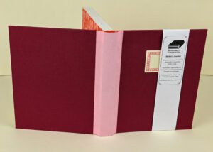 Handmade writer's journal, maroon and pink.